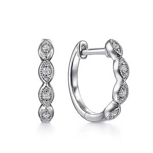 Elegant silver twisted hoop earrings with marquise-cut clear stones on white background