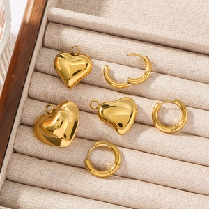 Golden 3D hollow heart pendant and circular hoop earring set in jewelry box
