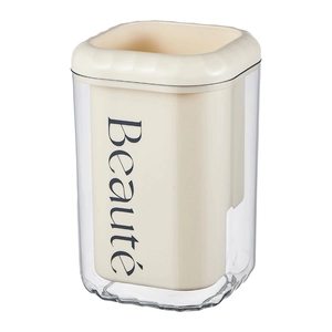 Cream-style utensil holder with beige inner and transparent shell featuring Beauté text