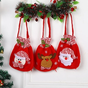 Three Christmas gift bags featuring 3D plush snowman, reindeer, and Santa Claus designs
