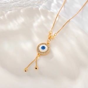 Elegant gold evil eye necklace featuring a zircon pendant and adjustable box chain link
