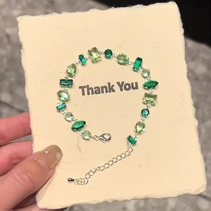 Green crystal bracelet with mixed cut stones and silver chain for women