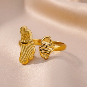 Detailed macro view of 18k gold plated stainless steel ginkgo leaf open ring texture