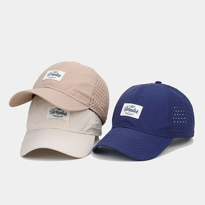 Detail view of quick-dry baseball caps with Paradise patch and laser-cut vents