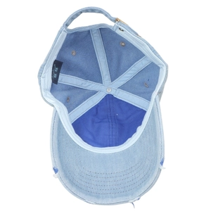 Internal view of denim baseball cap with reinforced lining and adjustable metal buckle