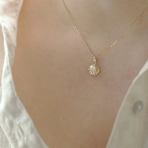 Elegant 14k gold plated S925 silver necklace featuring a shell pendant with a round pearl