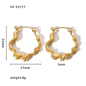 Irregular 18K gold plated stainless steel wave earrings measuring 32mm by 27mm