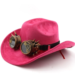 Macro shot of fuchsia faux suede cowboy hat with steampunk goggles and gold gear details