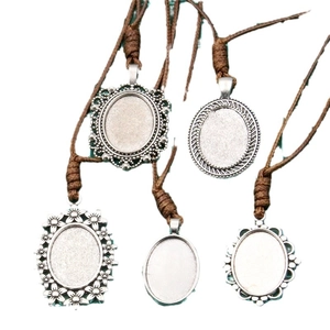Five antique silver oval pendant trays with brown PU cords for DIY jewelry making