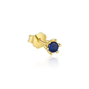 Macro shot of S925 sterling silver gold-plated stud earring with a blue zircon gemstone