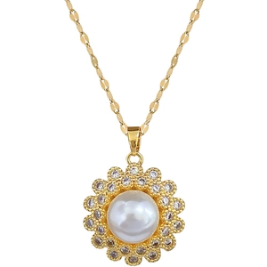 Elegant gold necklace with flower pendant featuring white pearl and double halo crystals
