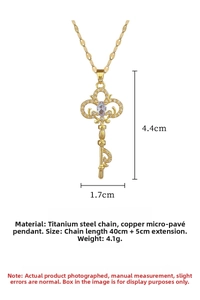 Macro shot of titanium steel key pendant necklace with micro-pave crystals and hollow design