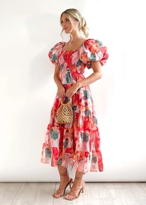 Detail of floral puff sleeve midi dress with ruffled bodice and tiered skirt