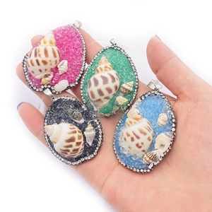 Set of four handmade shell pendants with colorful crushed stones and silver rhinestones
