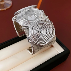 Macro detail of silver multi-layer wire wrapped cuff bracelet with clear crystal stone