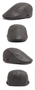 Detail view of dark grey PU leather ivy cap with metal buckle and stitched texture