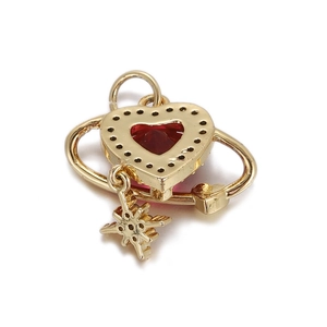 Detailed view of heart-shaped gold alloy pendant with red gemstone and star charm