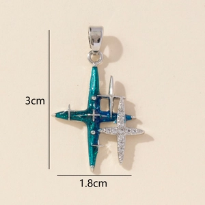 Macro shot showing dimensions of double cross pendant with blue gradient and zircons