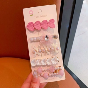 Detailed set of five hair clips with pearls, rhinestones, and pink resin hearts