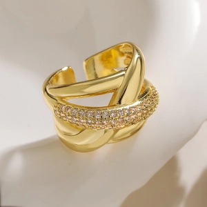 Irregular geometric gold layered ring with pave zircon crystals in a modern design