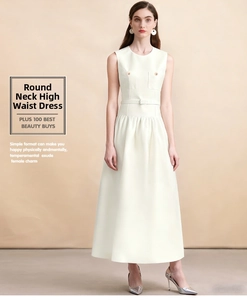 Detail of a white sleeveless midi dress with gold buttons and a matching slim waist belt