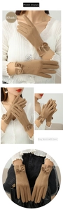 Detail of khaki thermal gloves with bow decor and wave stitching for winter warmth