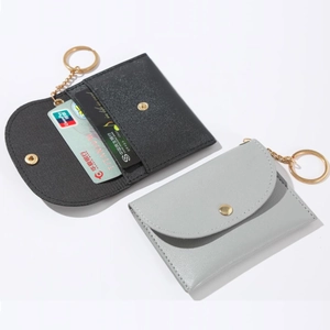 Minimalist PU leather coin purses in black and grey with gold keychains and snap closure