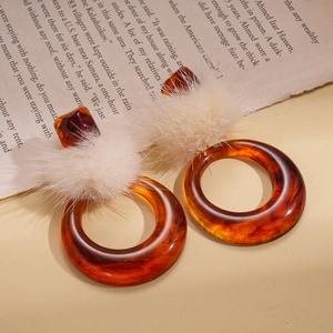 Retro amber resin hoop earrings with white fur balls and silver pins for women