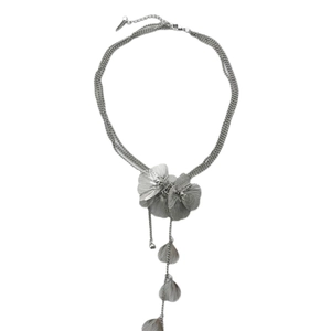 Statement silver layered necklace featuring textured floral pendant and hanging metallic leaves