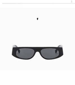 Detail view of stylish black rectangular sunglasses with glossy frame and dark lenses