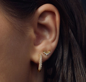 Close-up of gold-plated S925 sterling silver U-shaped hoop earrings with white zircon stones