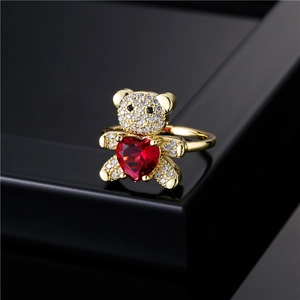 Adjustable gold teddy bear ring with heart shaped ruby and micro-paved white zircons