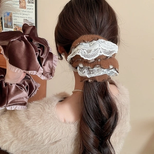 Detailed texture of brown velvet scrunchie and lace trim knit hair accessory set