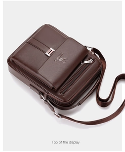 High-angle view of brown faux leather shoulder bag featuring top handle and logo detail