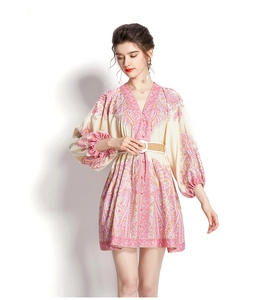 Detail of pink floral mini dress with V-neck, lantern sleeves and woven belt detail