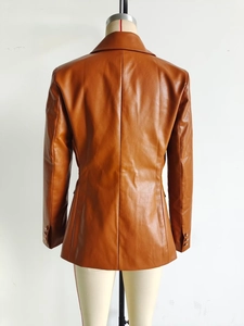 Detailed back view of caramel PU leather blazer featuring middle seam and buttoned cuffs