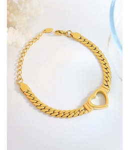 Detail of gold curb chain bracelet featuring hollow heart charm and K18 hallmark tag