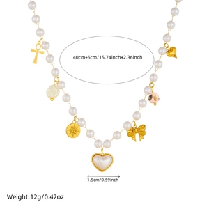 Faux pearl necklace with golden heart, cross and bow pendants on white background