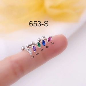 Macro view of 5 colors marquise cubic zirconia titanium steel stud earrings on fingertips