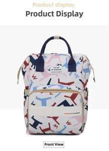 Front detail of a white floral diaper backpack with colorful patterns and brand label