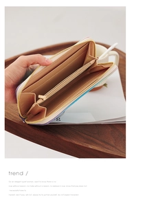 Internal view of a multi-color long zip wallet with multiple card slots and coin pocket