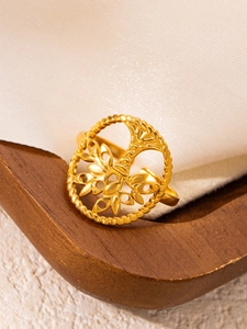 Macro detail of 18k gold tree of life hollow ring with open adjustable band