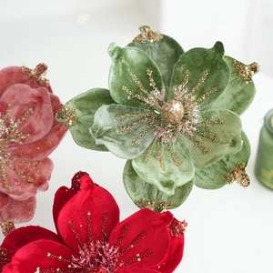 Velvet artificial magnolia flowers in red, green and pink with gold glitter details