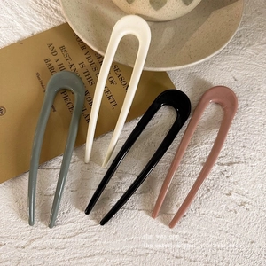 Minimalist U-shaped hair pins in four vintage colors with a glossy resin finish