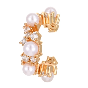 Detail of C-shaped gold ear cuff with white pearls and sparkling cubic zirconia stones