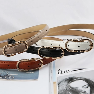 Detailed view of skinny leather belts in four colors with elegant gold metal buckles