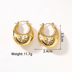 Detail of 18k gold plated hollow earrings showing starburst pattern and dimensions
