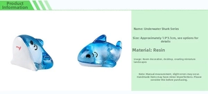 Detailed close-up of cute blue resin shark figurines for micro-landscape desktop decor