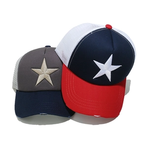 Detail of five-point star embroidery on breathable mesh trucker hats with vintage distress