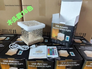 Close-up of USB water ripple lamp with 16-color remote and wooden base in packaging
